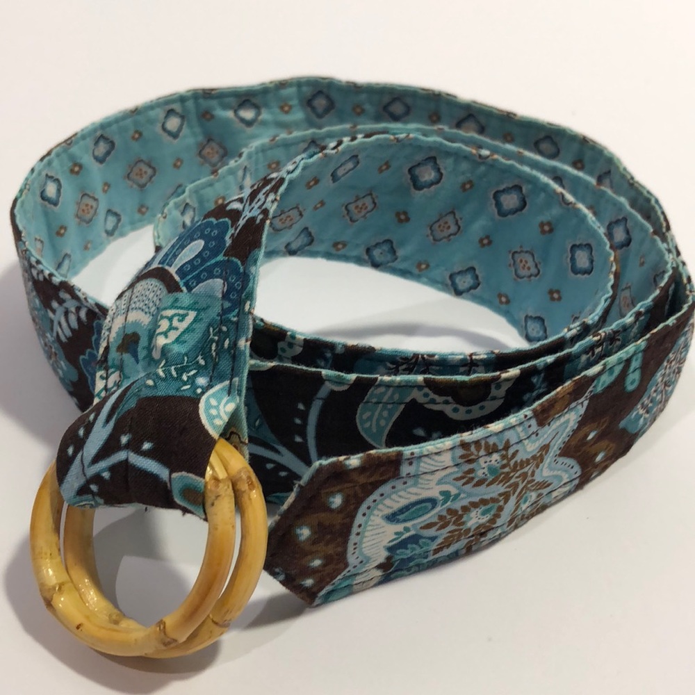 Vera Bradley cloth belt with wood ring buckles.